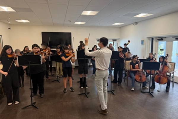 Middle school orchestra students perform