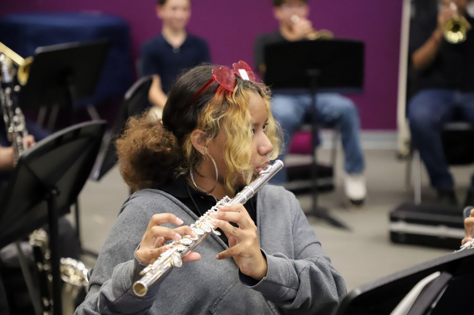 A girl plays the flute in music class at Wakefield during the second week of school