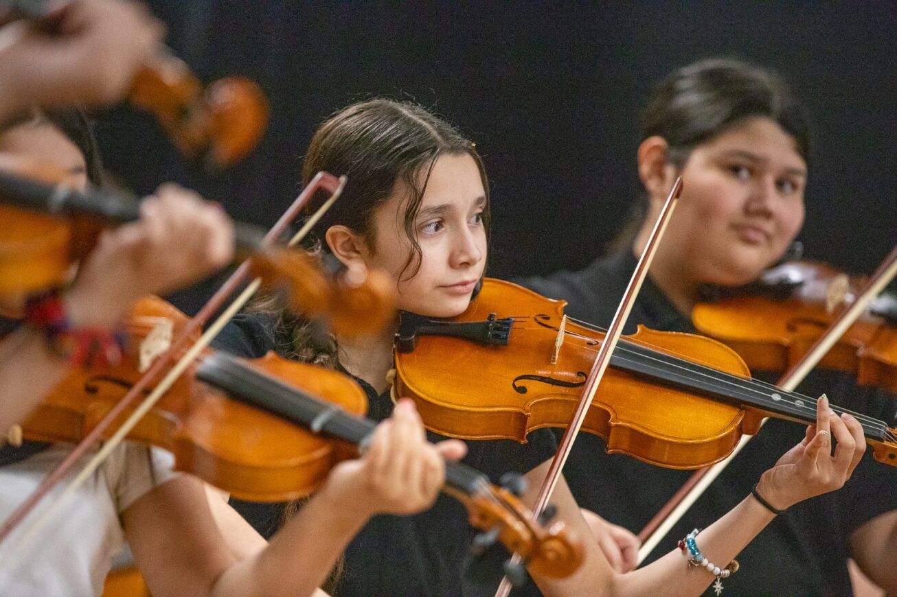 Students play their violins